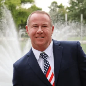 Picture of Josh Smith wearing a suit and an American Flag tie.