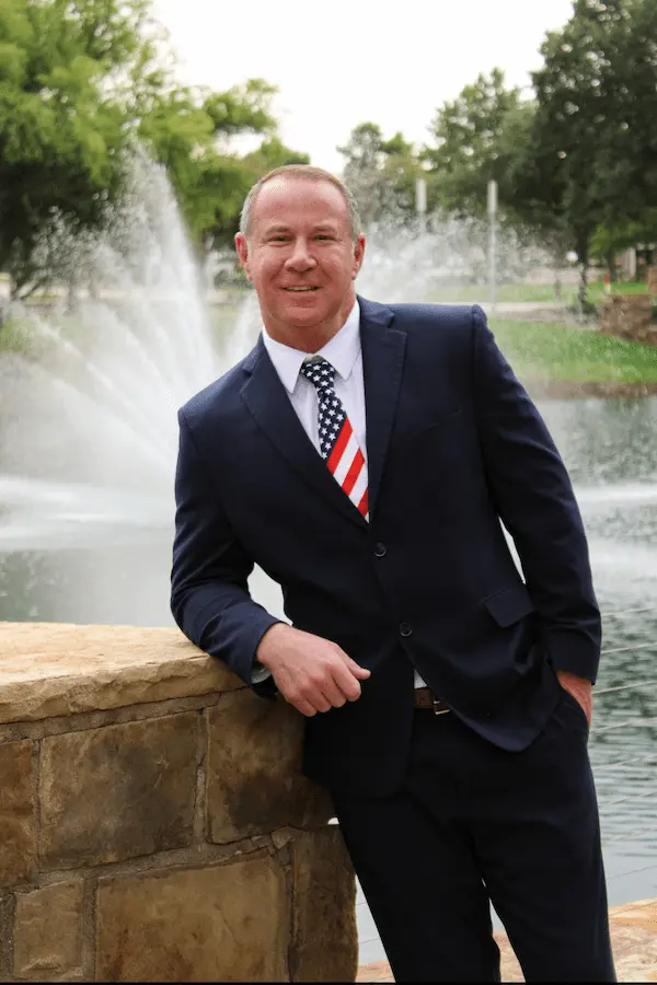 Picture of Josh Smith wearing a suit and an American Flag tie.